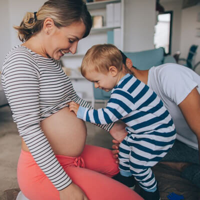 Pregnant women sitting on the floor