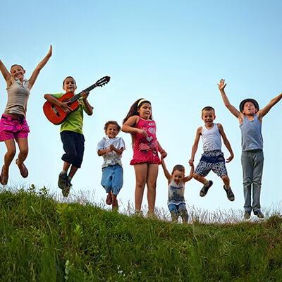 Group of young kids jumping in the air