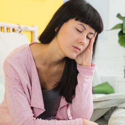 Women sitting on her bed