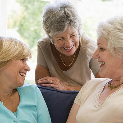 3 woman discussing and sharing ideas